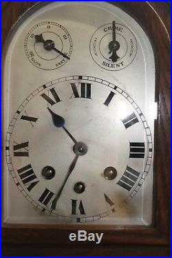 An Edwardian mantle clock with Westminster chimes and silvered dial