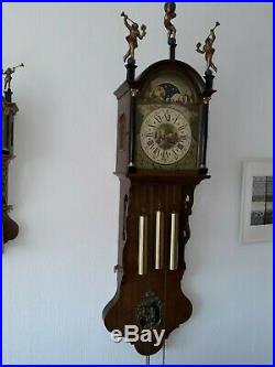 Antique Frisian tail clock with bronze Westminster chime and bridaldress