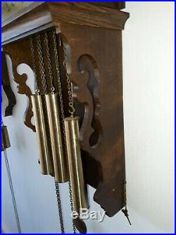 Antique Frisian tail clock with bronze Westminster chime and bridaldress