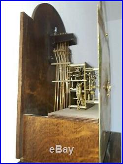 Antique Frisian tail clock with bronze Westminster chime and bridaldress