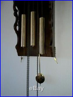 Antique Frisian tail clock with bronze Westminster chime and bridaldress