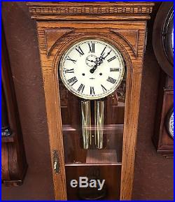 Beautiful Howard Miller Two Spring 2 Weight Westminster Chime Oak Wall Clock