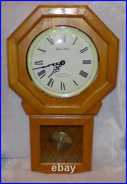 Daniel Dakota quartz Westminster chime hanging wall clock, oak. Works great