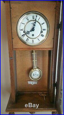 Howard Miller 612-462 Oak Wall 3 Chimes Clock with Westminster Chime Key Wind