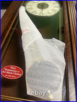 Howard Miller Ambassador Collection Wall Mounted Dial Grandfather Clock