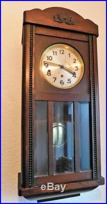 Oak cased westminster chiming wall clock